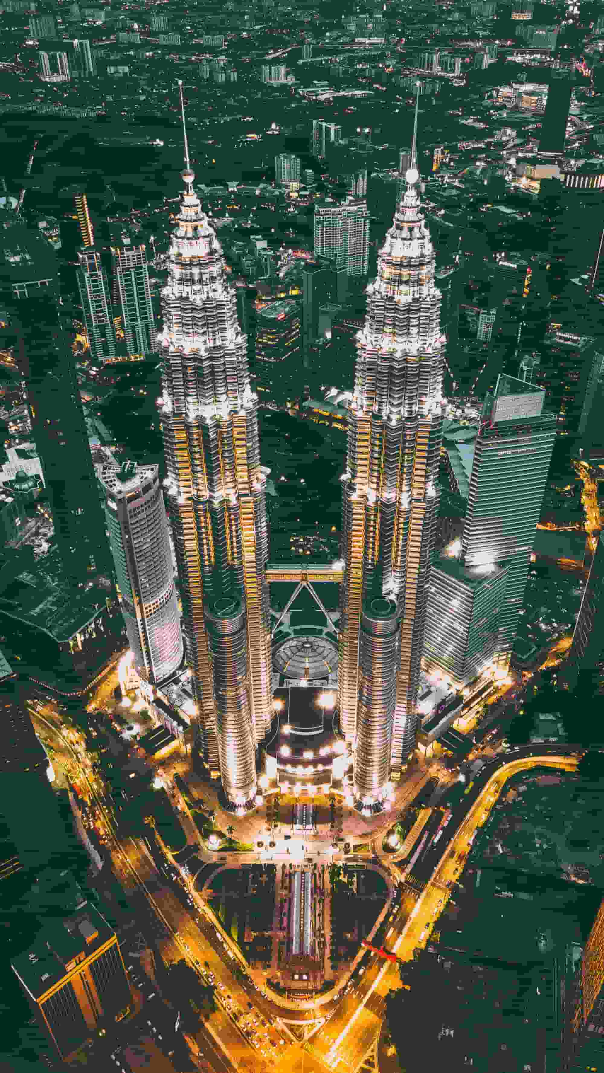 Stunning Kuala Lumpur skyline with iconic Petronas Twin Towers at night